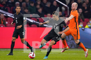 2022-03-29 - Jamal Musiala of Germany battles for the ball with Davy Klaassen of the Netherlands during the International Friendly football match between Netherlands and Germany on March 29, 2022 at the Johan Cruijff ArenA in Amsterdam, Netherlands - NETHERLANDS VS GERMANY - FRIENDLY MATCH - SOCCER