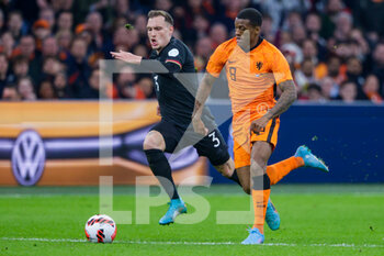 2022-03-29 - David Raum of Germany, Georginio Wijnaldum of the Netherlands during the International Friendly football match between Netherlands and Germany on March 29, 2022 at the Johan Cruijff ArenA in Amsterdam, Netherlands - NETHERLANDS VS GERMANY - FRIENDLY MATCH - SOCCER