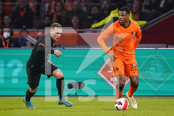 2022-03-29 - David Raum of Germany and Denzel Dumfries of the Netherlands during the International Friendly football match between Netherlands and Germany on March 29, 2022 at the Johan Cruijff ArenA in Amsterdam, Netherlands - NETHERLANDS VS GERMANY - FRIENDLY MATCH - SOCCER