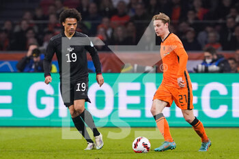 2022-03-29 - Leroy Sane of Germany battles for the ball with Frenkie de Jong of the Netherlands during the International Friendly football match between Netherlands and Germany on March 29, 2022 at the Johan Cruijff ArenA in Amsterdam, Netherlands - NETHERLANDS VS GERMANY - FRIENDLY MATCH - SOCCER