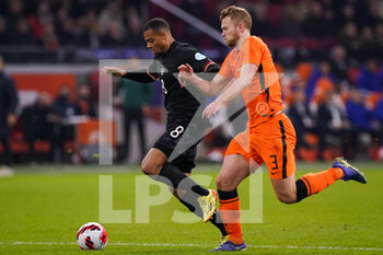 2022-03-29 - Lukas Nmecha of Germany battles for the ball with Matthijs de Ligt of the Netherlands during the International Friendly football match between Netherlands and Germany on March 29, 2022 at the Johan Cruijff ArenA in Amsterdam, Netherlands - NETHERLANDS VS GERMANY - FRIENDLY MATCH - SOCCER