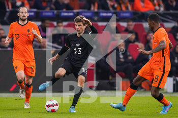 2022-03-29 - Thomas Muller of Germany battles for the ball with Daley Blind of the Netherlands and Georginio Wijnaldum of the Netherlands during the International Friendly football match between Netherlands and Germany on March 29, 2022 at the Johan Cruijff ArenA in Amsterdam, Netherlands - NETHERLANDS VS GERMANY - FRIENDLY MATCH - SOCCER
