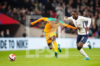 2022-03-29 - Ivory Coast forward Nicolas Pepe (19) and England defender Tyrick Mitchell during the Friendly football match between England and Ivory Coast on March 29, 2022 at Wembley Stadium in London, England - ENGLAND VS IVORY COAST - FRIENDLY MATCH - SOCCER