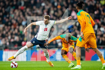 2022-03-29 - England forward Harry Kane (20) battles for possession with Ivory Coast midfielder Jean-Michael Seri during the Friendly football match between England and Ivory Coast on March 29, 2022 at Wembley Stadium in London, England - ENGLAND VS IVORY COAST - FRIENDLY MATCH - SOCCER