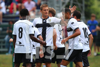 2022-07-23 - Valentin Mihaila of PARMA CALCIO celebrates after scoring a goal with his teammates during the friendly match between Parma Calcio and FeralpiSalò on July 23, 2022 in Pinzolo (TN), Italy. - PARMA CALCIO VS FERALPISALò - FRIENDLY MATCH - SOCCER