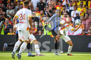 2022-07-23 - Valentino LAZARO of Inter Milan and Przemyslaw Adam FRANKOWSKI of Lens during the Pre Season Friendly football match between RC Lens and FC Internazionale Milano (Inter Milan) on July 23, 2022 at Bollaert-Delelis stadium in Lens, France - FOOTBALL - FRIENDLY GAME - RC LENS V FC INTER - INTERNAZIONALE MILANO - FRIENDLY MATCH - SOCCER