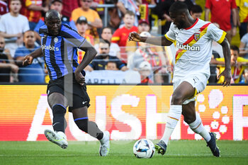 2022-07-23 - Romelu LUKAKU of Inter Milan and Kevin DANSO of Lens during the Pre Season Friendly football match between RC Lens and FC Internazionale Milano (Inter Milan) on July 23, 2022 at Bollaert-Delelis stadium in Lens, France - FOOTBALL - FRIENDLY GAME - RC LENS V FC INTER - INTERNAZIONALE MILANO - FRIENDLY MATCH - SOCCER