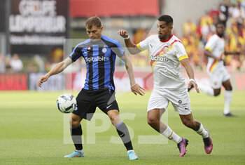 2022-07-23 - Nicolo Barella of Inter Milan, Facundo Medina of Lens during the Pre-Season Friendly football match between RC Lens and Inter Milan (FC Internazionale) on July 23, 2022 at Stade Bollaert-Delelis in Lens, France - FOOTBALL - FRIENDLY GAME - LENS V FC INTER - INTERNAZIONALE - FRIENDLY MATCH - SOCCER