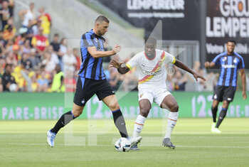 2022-07-23 - Edin Dzeko of Inter Milan, Kevin Danso of Lens during the Pre-Season Friendly football match between RC Lens and Inter Milan (FC Internazionale) on July 23, 2022 at Stade Bollaert-Delelis in Lens, France - FOOTBALL - FRIENDLY GAME - LENS V FC INTER - INTERNAZIONALE - FRIENDLY MATCH - SOCCER