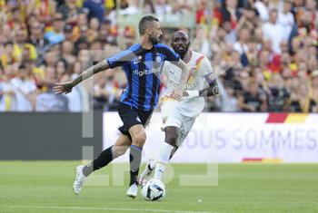 2022-07-23 - Marcelo Brozovic of Inter Milan, Seko Fofana of Lens during the Pre-Season Friendly football match between RC Lens and Inter Milan (FC Internazionale) on July 23, 2022 at Stade Bollaert-Delelis in Lens, France - FOOTBALL - FRIENDLY GAME - LENS V FC INTER - INTERNAZIONALE - FRIENDLY MATCH - SOCCER