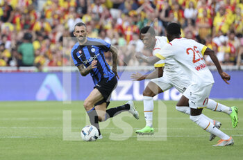 2022-07-23 - Marcelo Brozovic of Inter Milan, Lois Openda of Lens during the Pre-Season Friendly football match between RC Lens and Inter Milan (FC Internazionale) on July 23, 2022 at Stade Bollaert-Delelis in Lens, France - FOOTBALL - FRIENDLY GAME - LENS V FC INTER - INTERNAZIONALE - FRIENDLY MATCH - SOCCER