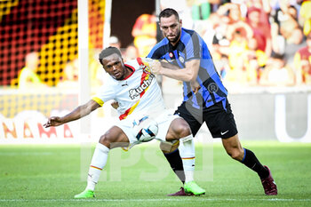 2022-07-23 - Lois OPENDA of Lens and Stefan DE VRIJ of Inter Milan during the Pre Season Friendly football match between RC Lens and FC Internazionale Milano (Inter Milan) on July 23, 2022 at Bollaert-Delelis stadium in Lens, France - FOOTBALL - FRIENDLY GAME - LENS V FC INTER - INTERNAZIONALE - FRIENDLY MATCH - SOCCER