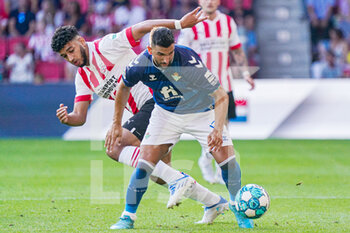 2022-07-23 - Martin Montoya of Real Betis, Ismael Saibari of PSV during the pre-season friendly football match between PSV and Real Betis on July 23, 2022 at Philips Stadion in Eindhoven, Netherlands - FOOTBALL - FRIENDLY GAME - PSV V REAL BETIS - FRIENDLY MATCH - SOCCER