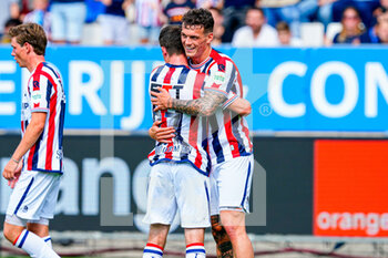 2022-07-23 - Nick Doodeman of Willem II, Jizz Hornkamp of Willem II celebrate after scoring a goal during the pre-season friendly football match between Willem II and Olympique Lyonnais on July 23, 2022 at Koning Willem II stadion in Tilburg, Netherlands - FOOTBALL - FRIENDLY GAME - WILLEM II V LYON - FRIENDLY MATCH - SOCCER