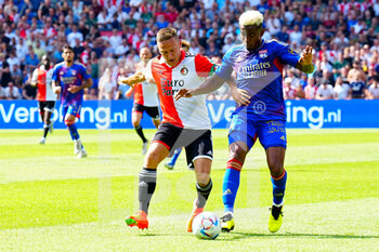 2022-07-24 - Thiago Mendes of Olympique Lyonnais, Jens Toornstra of Feyenoord during the Pre-season friendly match between Feyenoord and Olympique Lyon at Stadion Feyenoord on July 24, 2022 in Rotterdam, Netherlands - FOOTBALL - FRIENDLY GAME - FEYENOORD V LYON - FRIENDLY MATCH - SOCCER