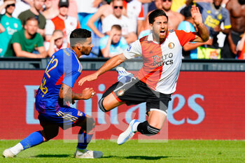 2022-07-24 - Alireza Jahanbakhsh of Feyenoord and Henrique of Lyon during the Pre-season friendly football match between Feyenoord and Olympique Lyonnais on July 24, 2022 at Stadion Feyenoord in Rotterdam, Netherlands - FOOTBALL - FRIENDLY GAME - FEYENOORD V LYON - FRIENDLY MATCH - SOCCER