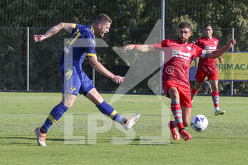 2022-07-30 - Thomas Henry of Hellas Verona competes for the ball with Matteo Bianchetti of US Cremonese during Hellas Verona vs US Cremonese, 5° frendly match pre-season Serie A Tim 2022-23, at Centro Sportivo 