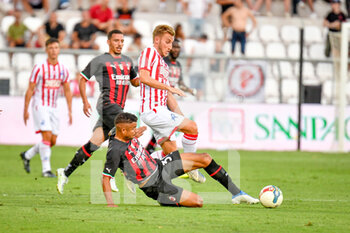 2022-08-06 - Milan's Junior Messias In action against Vicenza's Loris Zonta - LR VICENZA VS AC MILAN - FRIENDLY MATCH - SOCCER