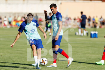 2022-07-27 - Yannick Carrasco and Stefan Savic of Atletico de Madrid warm up during the pre season friendly football match between Numancia and Atletico de Madrid on July 27, 2022 at Sporting Uxama stadium in El Burgo de Osma, Soria, Spain - FOOTBALL - FRIENDLY GAME - NUMANCIA V ATLETICO MADRID - FRIENDLY MATCH - SOCCER