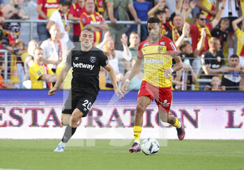 2022-07-30 - Facundo Medina of Lens, Jarrod Bowen of West Ham (left) during the pre-season friendly football match between RC Lens (RCL) and West Ham United FC on July 30, 2022 at Stade Bollaert-Delelis in Lens, France - FOOTBALL - FRIENDLY GAME - LENS V WEST HAM - FRIENDLY MATCH - SOCCER
