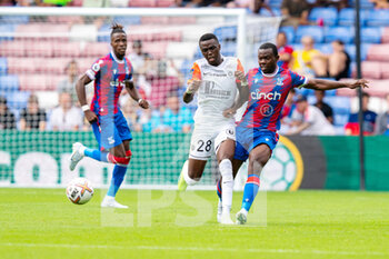 2022-07-30 - Crystal Palace defender Tyrick Mitchell (3) and Beni Makouana of Montpellier during the Pre-Season Friendly football match between Crystal Palace and Montpellier HSC on July 30, 2022 at Selhurst Park in London, England - FOOTBALL - FRIENDLY GAME - CRYSTAL PALACE V MONTPELLIER - FRIENDLY MATCH - SOCCER