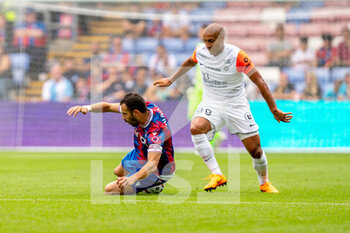 2022-07-30 - Crystal Palace midfielder Luka Milivojevic (4) is fouled by Montpellier forward Wahbi Khazri (99) during the Pre-Season Friendly football match between Crystal Palace and Montpellier HSC on July 30, 2022 at Selhurst Park in London, England - FOOTBALL - FRIENDLY GAME - CRYSTAL PALACE V MONTPELLIER - FRIENDLY MATCH - SOCCER