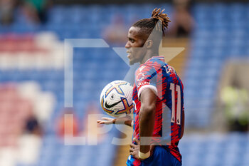 2022-07-30 - Crystal Palace forward Wilfried Zaha during the Pre-Season Friendly football match between Crystal Palace and Montpellier HSC on July 30, 2022 at Selhurst Park in London, England - FOOTBALL - FRIENDLY GAME - CRYSTAL PALACE V MONTPELLIER - FRIENDLY MATCH - SOCCER