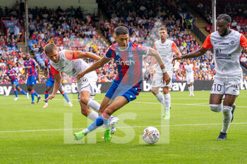 2022-07-30 - Crystal Palace forward Luke Plange (48) and Arnaud Souquet of Montpellier during the Pre-Season Friendly football match between Crystal Palace and Montpellier HSC on July 30, 2022 at Selhurst Park in London, England - FOOTBALL - FRIENDLY GAME - CRYSTAL PALACE V MONTPELLIER - FRIENDLY MATCH - SOCCER