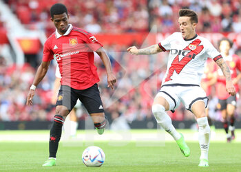 2022-08-01 - Manchester United midfielder Amad Diallo (16) and Rayo Vallecano defender Ivan Balliu (20) during the Pre-Season Friendly football match between Manchester United and Rayo Vallecano on July 31, 2022 at Old Trafford in Manchester, England - FOOTBALL - FRIENDLY GAME - MANCHESTER UNITED V RAYO VALLECANO - FRIENDLY MATCH - SOCCER