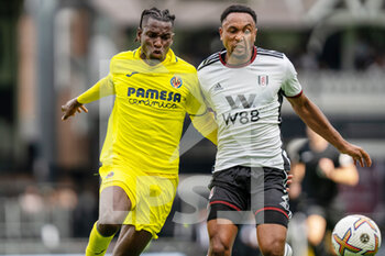 2022-07-31 - Villarreal forward Nicholas Jackson (18) battles with Fulham defender Kenny Tete (2) during the Pre-Season Friendly football match between Fulham and Villarreal CF on July 31, 2022 at Craven Cottage in London, England - FOOTBALL - FRIENDLY GAME - FULHAM V VILLARREAL - FRIENDLY MATCH - SOCCER