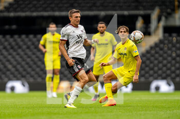 2022-07-31 - Fulham forward Joao Palhinha (26) battles with Villarreal forward Carlo Adriano (28) during the Pre-Season Friendly football match between Fulham and Villarreal CF on July 31, 2022 at Craven Cottage in London, England - FOOTBALL - FRIENDLY GAME - FULHAM V VILLARREAL - FRIENDLY MATCH - SOCCER