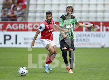 2022-07-31 - Rafik Guitane of Reims, Gian Marco Ferrari of Sassuolo during the pre-season friendly football match between Stade de Reims and US Sassuolo Calcio on July 31, 2022 at Stade Auguste Delaune in Reims, France - FOOTBALL - FRIENDLY GAME - REIMS V SASSUOLO - FRIENDLY MATCH - SOCCER
