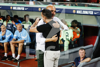 2022-08-24 - Pep Guardiola, head coach of Manchester City and Xavi Hernandez, head coach of FC Barcelona during the Friendly Football match between FC Barcelona and Manchester City on August 24, 2022 at Camp Nou stadium in Barcelona, Spain - FOOTBALL - FRIENDLY GAME - FC BARCELONA V MANCHESTER CITY - FRIENDLY MATCH - SOCCER