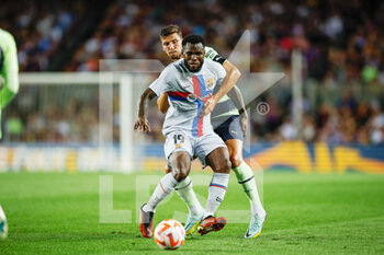2022-08-24 - Franck Kessie of FC Barcelona and Ruben Dias of Manchester City during the Friendly Football match between FC Barcelona and Manchester City on August 24, 2022 at Camp Nou stadium in Barcelona, Spain - FOOTBALL - FRIENDLY GAME - FC BARCELONA V MANCHESTER CITY - FRIENDLY MATCH - SOCCER
