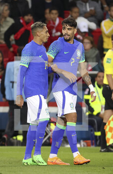 2022-09-27 - Raphinha of Brazil celebrates his goal with Lucas Paqueta of Brazil during the International friendly game, football match between Brazil and Tunisia on September 27, 2022 at Parc des Princes stadium in Paris, France - FOOTBALL - FRIENDLY GAME - BRAZIL V TUNISIA - FRIENDLY MATCH - SOCCER