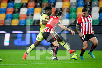 2022-12-17 - Udinese's Ebosele Festy in action against Athletic Bilbao's Dani Vivian and Athletic Bilbao's Ander Capa - UDINESE CALCIO VS ATHLETIC BILBAO - FRIENDLY MATCH - SOCCER