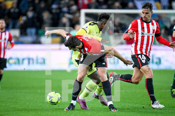 2022-12-17 - Udinese's Isaac Success in action against  Athletic Bilbao's Aitor Paredes - UDINESE CALCIO VS ATHLETIC BILBAO - FRIENDLY MATCH - SOCCER