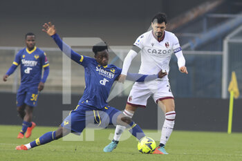 2022-12-22 - Ibrahim Sulemana of Hellas Verona FC competes for the ball with Roberto Soriano of Bologna FC during Hellas Verona vs Bologna FC, frendly match Serie A Tim 2022-23, at Marcantonio Bentegodi stadium in Verona (VR), Italy, on December 22, 2022. - HELLAS VERONA FC VS BOLOGNA FC - FRIENDLY MATCH - SOCCER