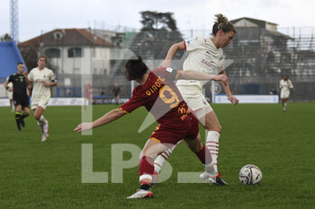 2022-01-05 - Valeria Pirone of AS Roma Women and Laura Sylvie Claudia Agard of A.C. Milan during the Women's Italian Supercup Semi-Final between A.S. Roma Women and A.C. Milan at the Domenico Francioni Stadium on 5th of January, 2022 in Latina, Italy. - AS ROMA VS AC MILAN - WOMEN SUPERCOPPA - SOCCER