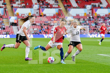 2022-07-07 - Caroline Graham Hansen (10) of Norway on the attack battles for possession with Kelsie Burrows (13) of Northern Ireland and Sarah McFadden (4) of Northern Ireland during the UEFA Women's Euro 2022, Group A football match between Norway and Northern Ireland on July 7, 2022 at the St Mary's Stadium in Southampton, England - FOOTBALL - WOMEN'S EURO 2022 - NORWAY V NORTHERN IRELAND - UEFA EUROPEAN - SOCCER