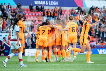 2022-07-13 - Damaris Egurroia of Netherlands (21) scores and celebrates 1-0 with team mates during the UEFA Women's Euro 2022, Group C football match between Netherlands and Portugal on July 13, 2022 at Leigh Sports Village in Leigh, England - FOOTBALL - WOMEN'S EURO 2022 - NETHERLANDS V PORTUGAL - UEFA EUROPEAN - SOCCER