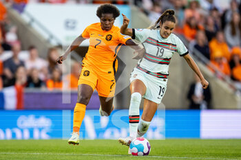 2022-07-13 - Portugal Defender Diana Gomes (19) battles for possession with Lineth Beerensteyn of Netherlands (7) during the UEFA Women's Euro 2022, Group C football match between Netherlands and Portugal on July 13, 2022 at Leigh Sports Village in Leigh, England - FOOTBALL - WOMEN'S EURO 2022 - NETHERLANDS V PORTUGAL - UEFA EUROPEAN - SOCCER