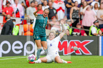 2022-07-31 - Millie Bright of England slides in and tackles Sydney Lohmann of Germany during the UEFA Women's Euro 2022, Final football match between England and Germany on July 31, 2022 at Wembley Stadium in London, England - FOOTBALL - WOMEN'S EURO 2022 - FINAL - ENGLAND V GERMANY - UEFA EUROPEAN - SOCCER