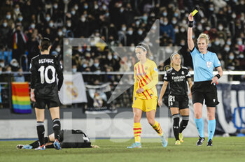 2022-03-22 - 20.03.2022, Madrid, Spain. Referee Lina Lehtovaara (C) shows a yellow card for Aitiana Bonmati of FC Barcelona (L)  during the UEFA Women's Champions League match between Real Madrid and FC Barcelona at Estadio Alfredo Di Stefano on 20 March 2022 in Madrid Spain. - REAL MADRID VS FC BARCELONA - UEFA CHAMPIONS LEAGUE WOMEN - SOCCER