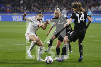 2022-03-31 - Delphine CASCARINO of Lyon and Linda SEMBRANT of Juventus and Sofie JUNGE PEDERSEN of Juventus during the UEFA Women's Champions League, Quarter-finals, 2nd leg football match between Olympique Lyonnais (Lyon) and Juventus FC on March 31, 2022 at Groupama stadium in Decines-Charpieu near Lyon, France - OLYMPIQUE LYONNAIS (LYON) VS JUVENTUS FC - UEFA CHAMPIONS LEAGUE WOMEN - SOCCER
