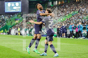 2022-02-15 - Raheem Sterling (7) of Manchester City celebrates a goal 0-5 with Bernardo Silva during the UEFA Champions League, round of 16, 1st leg football match between Sporting Lisbon and Manchester City on February 15 2022 at Estadio Jose Alvalade in Lisbon, Portugal - SPORTING LISBON VS MANCHESTER CITY - UEFA CHAMPIONS LEAGUE - SOCCER