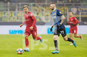 2022-02-16 - Liverpool forward Roberto Firmino (9), Inter Milan midfielder Marcelo Brozovic (77) during the UEFA Champions League, Round of 16, 1st leg football match between FC Internazionale and Liverpool FC on February 16, 2022 at San Siro Stadium in Milan, Italy - INTER - FC INTERNAZIONALE VS LIVERPOOL FC - UEFA CHAMPIONS LEAGUE - SOCCER