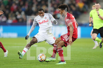 2022-02-16 - Kingsley Coman of Bayern Munich and Mohamed Camara of RB Salzburg during the UEFA Champions League, Round of 16, 1st leg football match between RB Salzburg and Bayern Munich on February 16, 2022 at Red Bull Arena in Salzburg, Austria - RB SALZBURG VS BAYERN MUNICH - UEFA CHAMPIONS LEAGUE - SOCCER