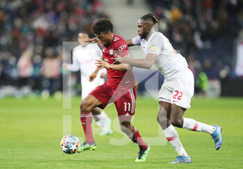 2022-02-16 - Kingsley Coman of Bayern Munich and Oumar Solet of RB Salzburg during the UEFA Champions League, Round of 16, 1st leg football match between RB Salzburg and Bayern Munich on February 16, 2022 at Red Bull Arena in Salzburg, Austria - RB SALZBURG VS BAYERN MUNICH - UEFA CHAMPIONS LEAGUE - SOCCER