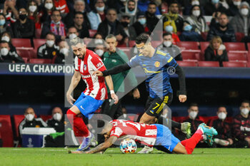 2022-02-23 - Angel Correa and Reinildo Mandava of Atletico de Madrid and Cristiano Ronaldo of Manchester United during the UEFA Champions League, round of 16, 1st leg football match between Atletico de Madrid and Manchester United on February 23, 2022 in Madrid, Spain - ATLETICO DE MADRID VS MANCHESTER UNITED - UEFA CHAMPIONS LEAGUE - SOCCER